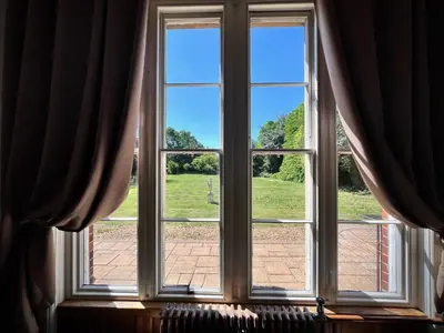 an open window with a view of a field at Willingham House Hotel in Willingham