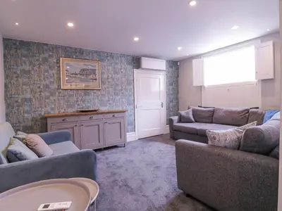 a living room with two couches and a table at Number 1 in Sudbury
