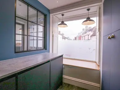 a kitchen with a counter and a large window at Number 1 in Sudbury