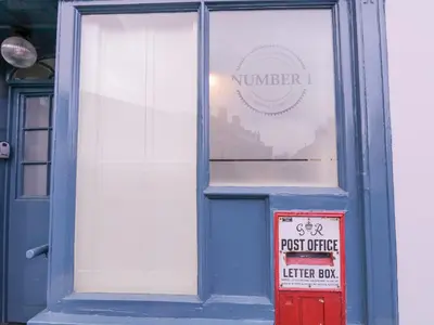 a blue door with a sign in a window at Number 1 in Sudbury