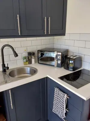 a kitchen counter with a sink and a toaster at Rocklands Retreat in Rockland Saint Peter