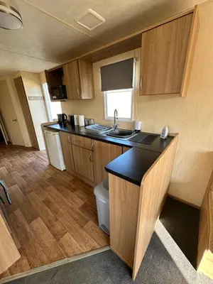 a small kitchen with a sink and a toilet at Seawick Holiday Home Horizon 363 in Saint Osyth