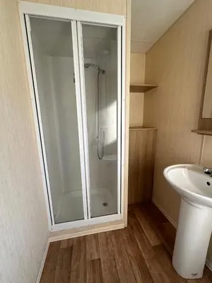 a bathroom with a shower and a sink at Seawick Holiday Home Horizon 363 in Saint Osyth