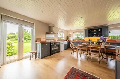 a kitchen with a table and a dining room at Cutbush Farm House 6 in Hingham