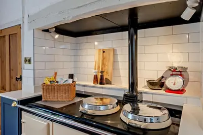 a kitchen with two pots on top of a stove at 5 Bed in Methwold oc-r29770 in Methwold