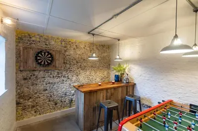 a game room with a table and pool tables at 5 Bed in Methwold oc-r29770 in Methwold