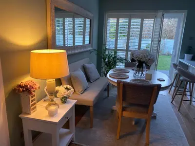 a living room with a couch and a table at Bowershott in Letchworth