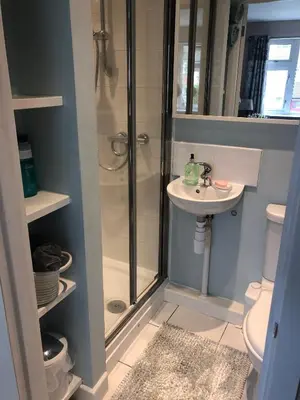 a bathroom with a shower and a sink at Bowershott in Letchworth