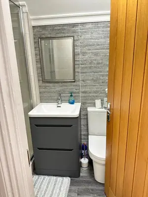 a bathroom with a sink and a toilet at The Cosy Place near centre in Ipswich