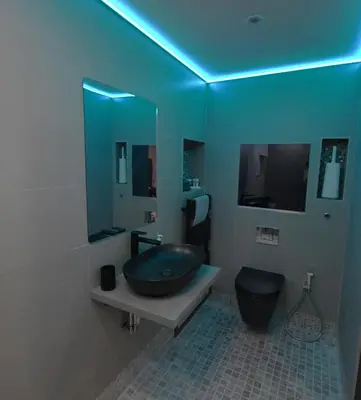 a bathroom with a sink and a toilet and a mirror at Luxury Non Smoking 2 bedroom retreat in Norfolk in Attleborough