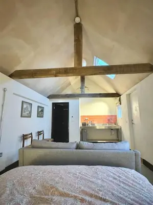 a bedroom with a bed in a room at Cambridgeshire Wabi-sabi in Barrington