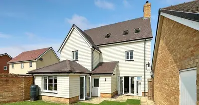 a white house with a brown roof at Colchester Spacious Double Rooms in CO4 in Mile End