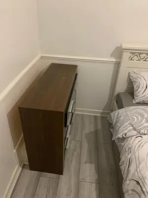 a room with a wooden desk next to a bed at At Apex House single room in Horndon on the Hill