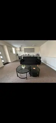 a living room with a couch and a table at New Luxury flats in Ipswich