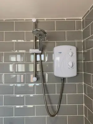 a shower in a bathroom with a shower head at Cosy Studio Apartment in Leigh-on-Sea, Close to Bell Wharf Beach & Adventure Island in Leigh-on-Sea
