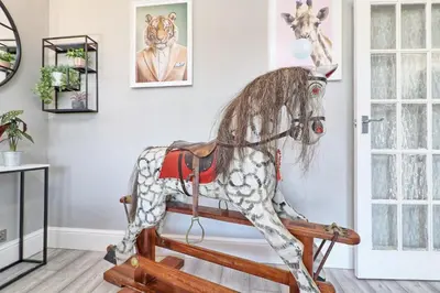 a statue of a rocking horse in a room at Rayleigh Weir - Luxury 3 bedroom house with games room in Rayleigh