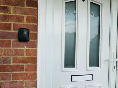 a white door with a window on a brick wall at Contractors families free parking Ramsey Road in St Ives