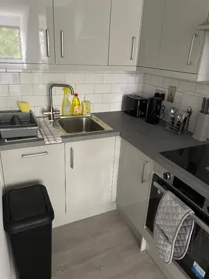 a kitchen with a sink and a counter top at Royal Oak Apartments 7 - Free Secure Parking - 2 Bedroom - Perfect for Contractors in Brentwood