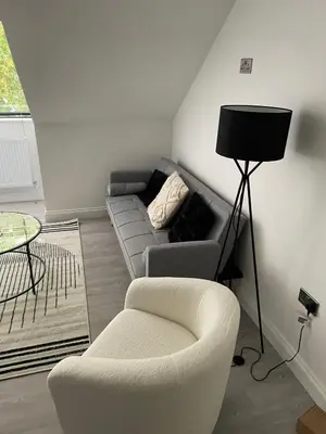 a living room with a couch and a chair at Royal Oak Apartments 7 - Free Secure Parking - 2 Bedroom - Perfect for Contractors in Brentwood