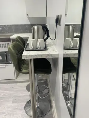 a kitchen with a counter with a tea kettle on it at Cozy Studio Flat - Romford, London in Havering atte Bower