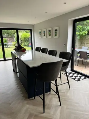 a dining room with a table and chairs at Beautiful family home with hot tub in Wivenhoe