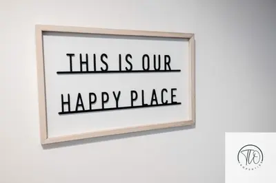 a picture of a framed sign that reads this is our happy place at Jardine House in Colchester