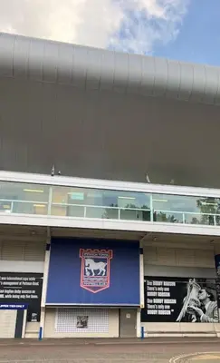 a building with a sign on the side of it at 7a Sir Alf Ramsey Way in Ipswich