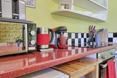 a kitchen counter top with a coffee maker on it at Walton Beach Holiday Lets in Walton-on-the-Naze