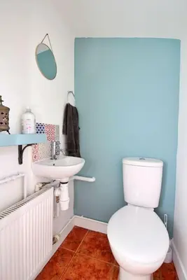 a bathroom with a toilet and a sink at Cottage in Walton on the Naze in Walton-on-the-Naze