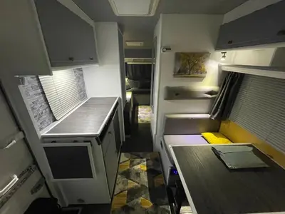 an interior view of a small kitchen in an rv at Surfer Mammut in Ipswich