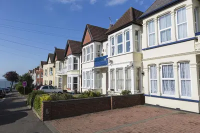 a row of houses on a city street at Southend Guest House - Close to Beach, Train Station & Southend Airport in Southend-on-Sea