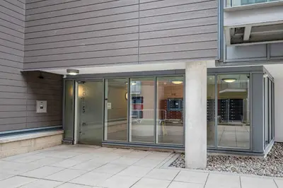 an entrance to an office building with glass doors at Ipswich Marina1 2 bed2bath apt in Ipswich