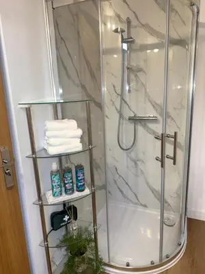 a shower in a bathroom with a glass shower at One Granary Barns near Stansted Airport in Elsenham