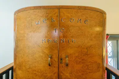 a wooden door with welcome to autumn written on it at Mill House in Thorpeness