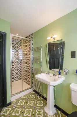 a bathroom with a sink and a shower at Mill House in Thorpeness