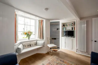 a living room with a window and a window seat at 10 Hertford Place in Aldeburgh