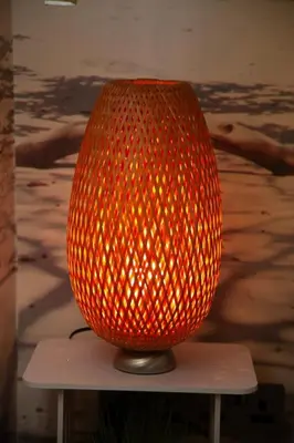 a large orange glass vase sitting on a table at The Palm Tree House in St Ives