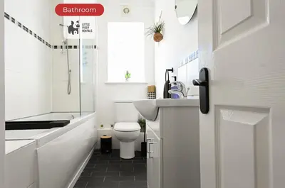 a bathroom with a toilet and a sink at Quiet Premium Stansted Apartment in Central Location with WiFi and Desk in Stansted Mountfitchet