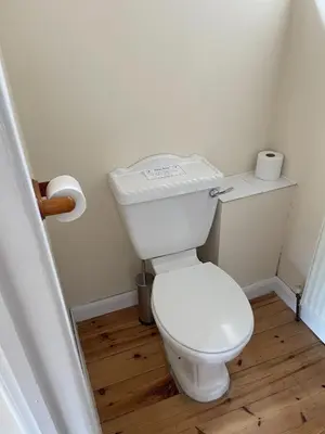 a bathroom with a white toilet in a room at Kings Barn - English Countryside Retreat in Lindsell