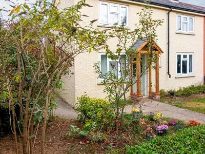 a house with a garden in front of it at Ivy Rose Cottage in Ipswich