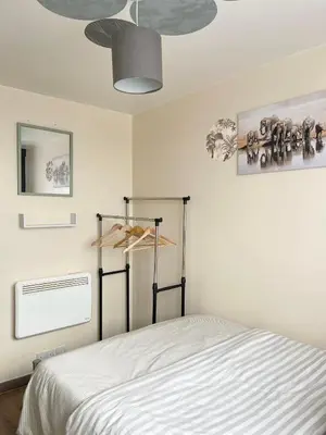 a bedroom with a bed and a ceiling fan at Penn Gardens Spacious 2 Beds - 1 in Friern Barnet