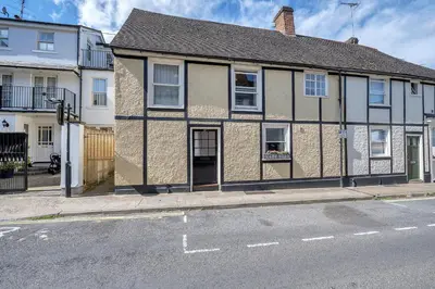 a building on the side of a street at Charming cottage in the centre of town in Bury Saint Edmunds