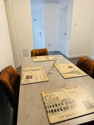 a table with menus on it in a room at Canvey Stay Entire Flat in Canvey Island