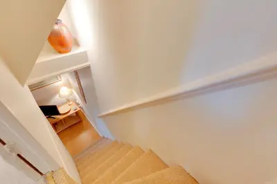 a view of a stairway in a room at Pass the Keys Charming Cottage in City Centre with Free parking in Cambridge
