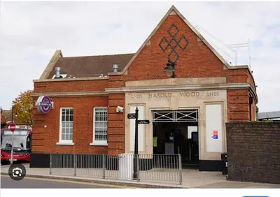 a red brick building with a sign on it at 1 Bed House Sleeps 2 -Free Parking -Tv in Romford