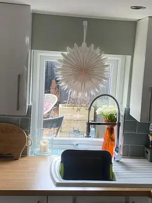 a kitchen counter with a sink and a window at Sun lane cottage in Woodbridge