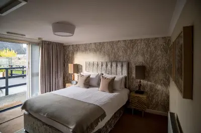 a bedroom with a large bed and a window at Brewers Inn in Cambridge
