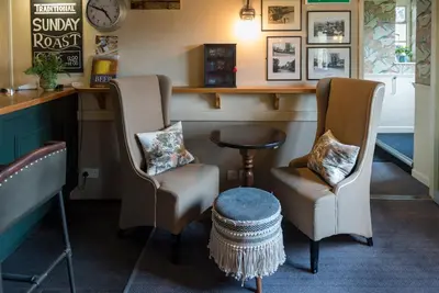 two chairs and a table in a barber shop at Brewers Inn in Cambridge