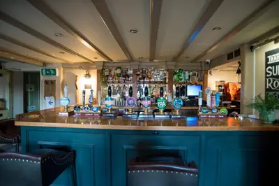 a bar in a pub with a blue counter at Brewers Inn in Cambridge