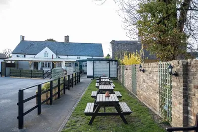 a row of benches in front of a building at Brewers Inn in Cambridge